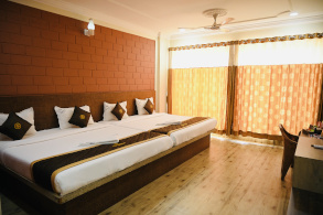 AC double room at Hotel Parijatha Inn Dharmasthala with attached bathroom and air conditioning